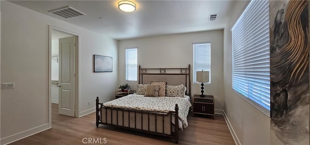 5232 Las Palmas Way, Chino, CA 91710 - bedroom with multiple windows, wood finished floors, and baseboards