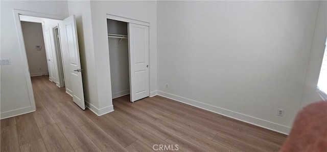 5232 Las Palmas Way, Chino, CA 91710 - unfurnished bedroom featuring wood finished floors, baseboards, and a closet
