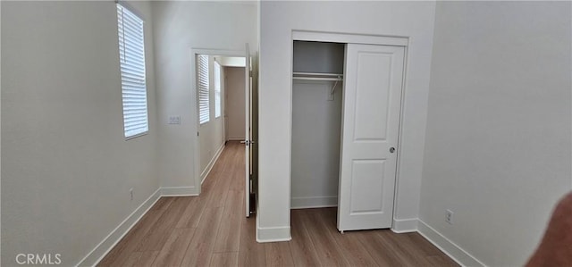 5232 Las Palmas Way, Chino, CA 91710 - unfurnished bedroom featuring wood finished floors, baseboards, and a closet