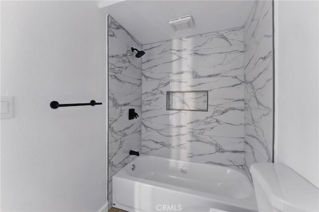 full bathroom with tub / shower combination, visible vents, and toilet