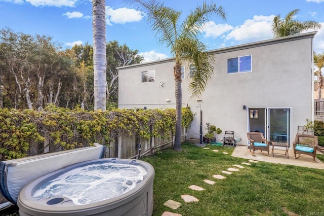 303305 Sanford St, Encinitas, CA 92024 - back of property with a hot tub, stucco siding, and a patio