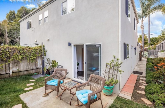 303305 Sanford St, Encinitas, CA 92024 - rear view of house with fence and stucco siding