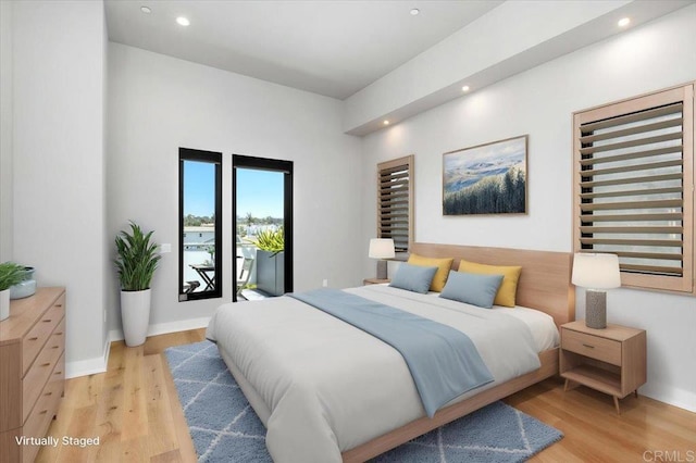 2677 State St # 301, Carlsbad, CA 92008 - bedroom with recessed lighting and light wood-style flooring