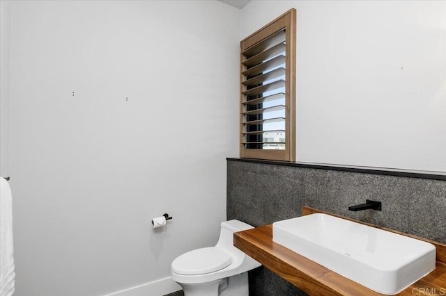 2677 State St # 301, Carlsbad, CA 92008 - bathroom featuring toilet and baseboards