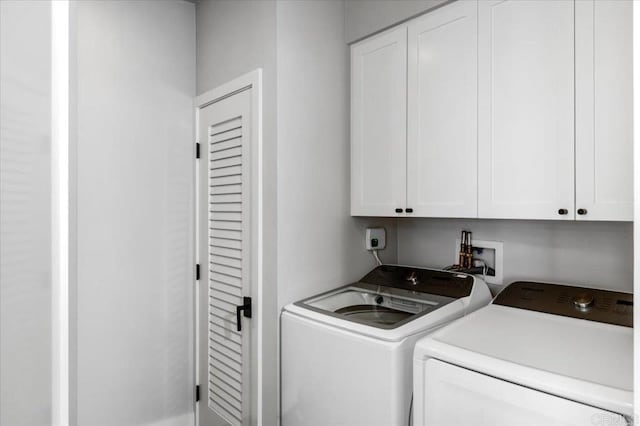 2677 State St # 301, Carlsbad, CA 92008 - laundry room with cabinet space and washer and clothes dryer