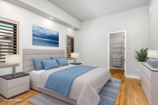 2677 State St # 301, Carlsbad, CA 92008 - bedroom with a walk in closet, light wood-style flooring, and recessed lighting