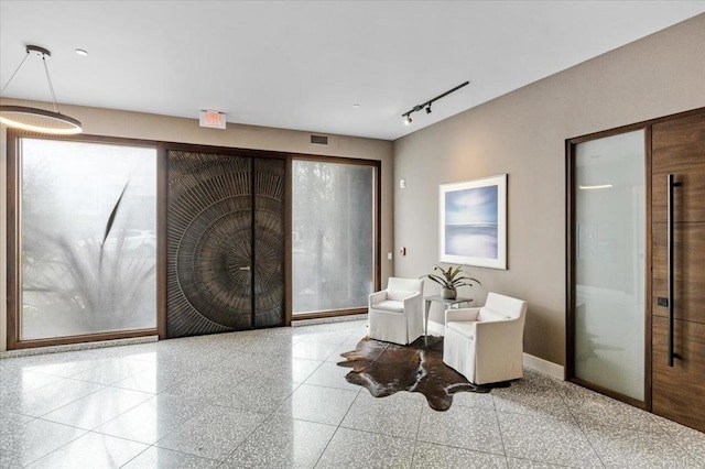 2677 State St # 301, Carlsbad, CA 92008 - living area with track lighting and granite floors
