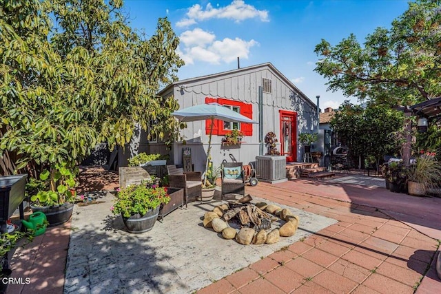 view of patio / terrace with an outdoor fire pit