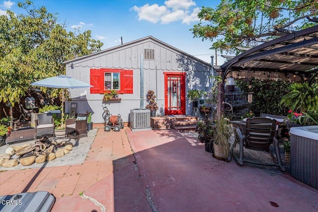 exterior space featuring a pergola and central AC