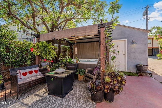 view of patio / terrace featuring a hot tub