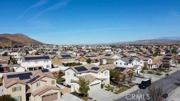 aerial view with a mountain view and a residential view