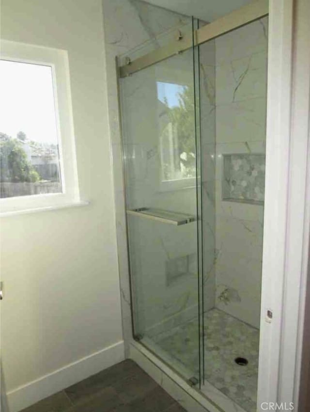 340 Foxenwood Dr, Santa Maria, CA 93455 - bathroom featuring a marble finish shower and baseboards