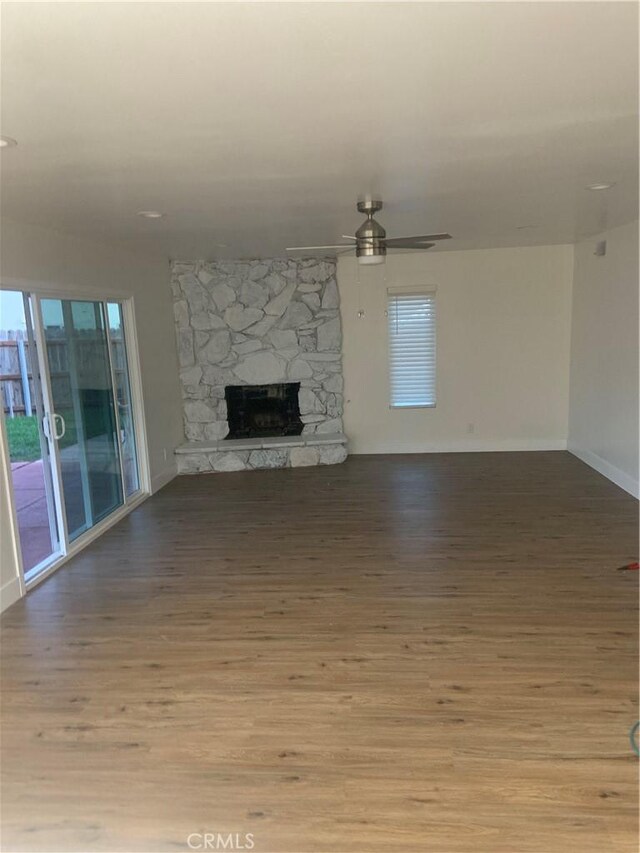 340 Foxenwood Dr, Santa Maria, CA 93455 - unfurnished living room with baseboards, a ceiling fan, wood finished floors, and a fireplace