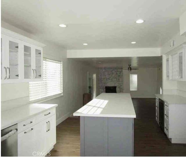 340 Foxenwood Dr, Santa Maria, CA 93455 - kitchen with open floor plan, a center island, light countertops, and white cabinetry