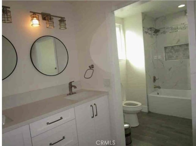 340 Foxenwood Dr, Santa Maria, CA 93455 - full bath with bathtub / shower combination, toilet, wood finished floors, a sink, and double vanity