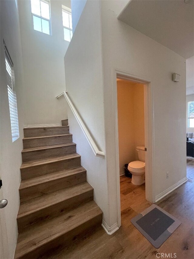 1406 Girona Dr, Pomona, CA 91766 - stairway featuring baseboards and wood finished floors