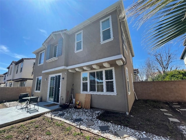 1406 Girona Dr, Pomona, CA 91766 - back of property featuring stucco siding, a patio area, and fence private yard