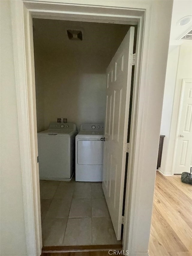 1406 Girona Dr, Pomona, CA 91766 - laundry area featuring washing machine and dryer, laundry area, and wood finished floors