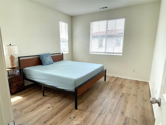 1406 Girona Dr, Pomona, CA 91766 - bedroom featuring baseboards, visible vents, and light wood-type flooring