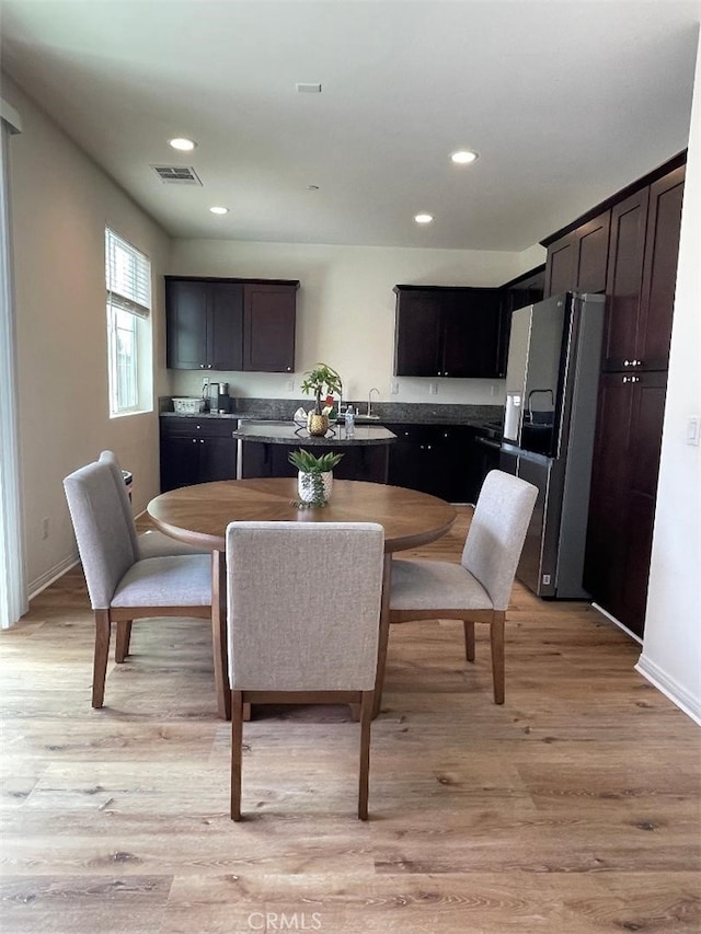 1406 Girona Dr, Pomona, CA 91766 - dining area with baseboards, visible vents, light wood-style floors, and recessed lighting