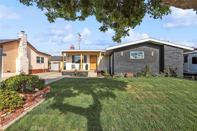 2902 Ladoga Ave, Long Beach, CA 90815 - view of front of property with a front lawn and covered porch