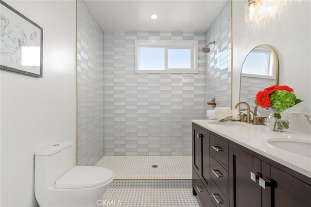 2902 Ladoga Ave, Long Beach, CA 90815 - bathroom with double vanity, tiled shower, toilet, and recessed lighting