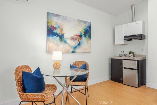 2902 Ladoga Ave, Long Beach, CA 90815 - dining area featuring baseboards and light wood-type flooring