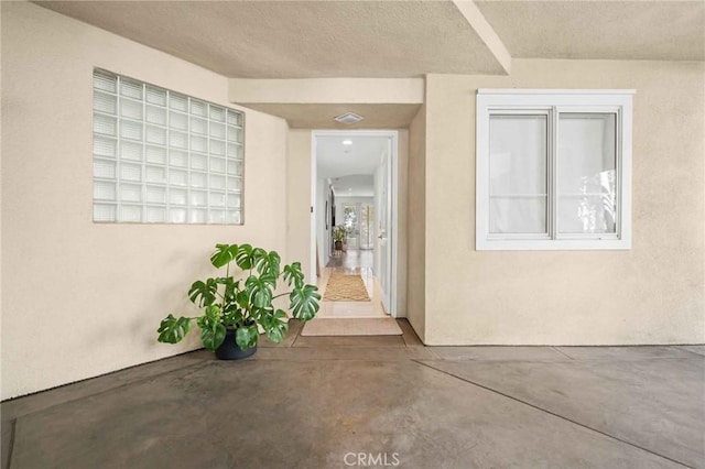 2233 Martin Unit 212, Irvine, CA 92612 - doorway to property with a patio area and stucco siding
