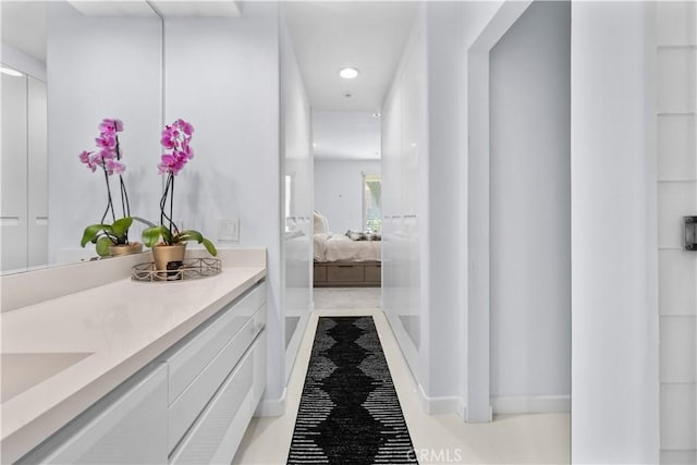 2233 Martin Unit 212, Irvine, CA 92612 - ensuite bathroom featuring vanity, tile patterned floors, and recessed lighting