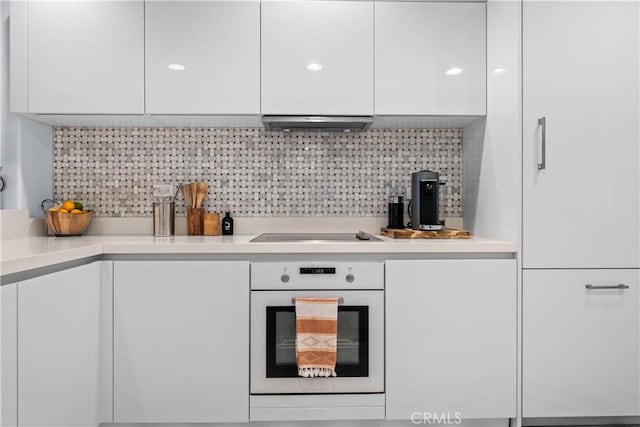 2233 Martin Unit 212, Irvine, CA 92612 - kitchen with cooktop, modern cabinets, white oven, and white cabinets