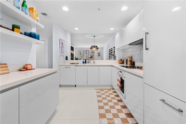 2233 Martin Unit 212, Irvine, CA 92612 - kitchen with light countertops, white cabinets, open shelves, and white appliances