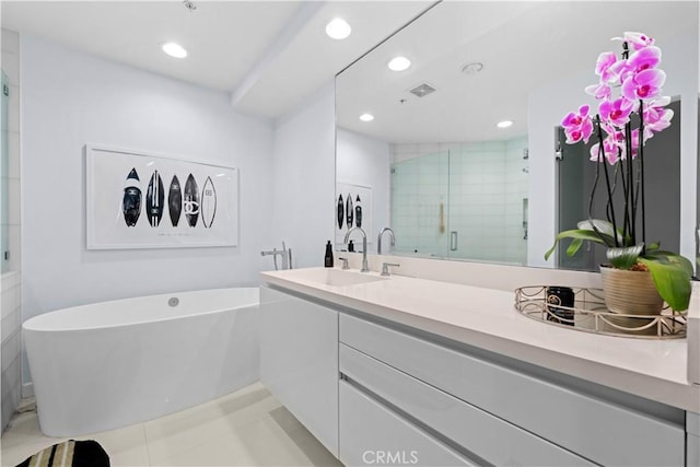 2233 Martin Unit 212, Irvine, CA 92612 - full bath with tile patterned flooring, vanity, recessed lighting, a soaking tub, and a stall shower
