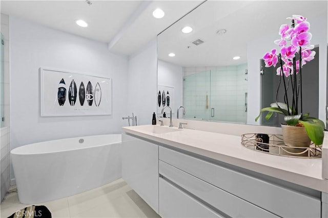 2233 Martin Unit 212, Irvine, CA 92612 - full bath featuring recessed lighting, vanity, a freestanding tub, a shower stall, and tile patterned flooring