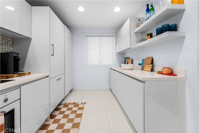 2233 Martin Unit 212, Irvine, CA 92612 - kitchen featuring white oven, white cabinets, open shelves, and recessed lighting