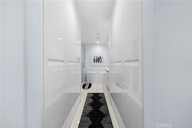 2233 Martin Unit 212, Irvine, CA 92612 - bathroom with a stall shower, a freestanding bath, and tile patterned flooring
