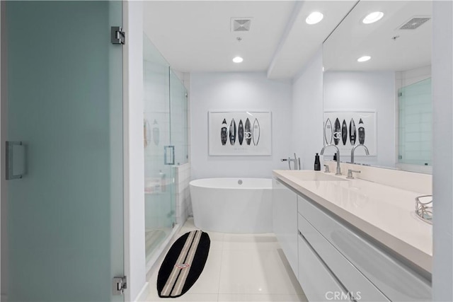 2233 Martin Unit 212, Irvine, CA 92612 - full bath with a freestanding bath, vanity, tile patterned floors, visible vents, and a stall shower