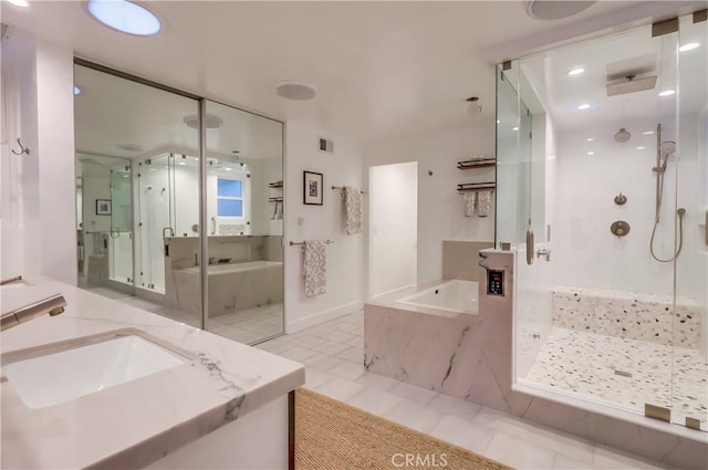 full bath with visible vents, tile patterned floors, a garden tub, vanity, and a marble finish shower