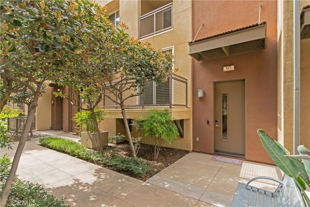 615 Rockefeller, Irvine, CA 92612 - property entrance featuring stucco siding and elevator