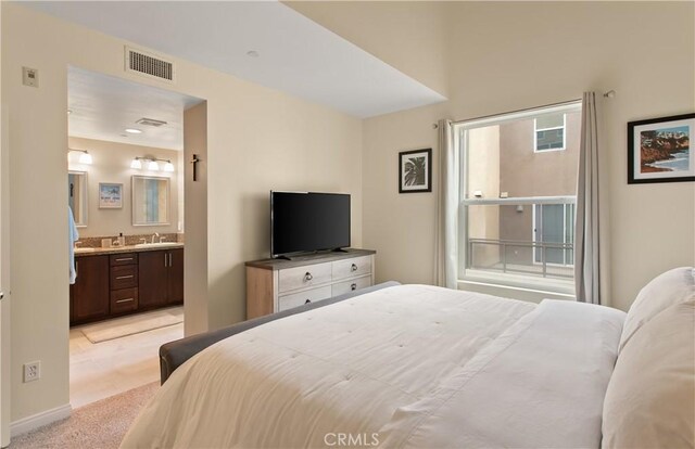 615 Rockefeller, Irvine, CA 92612 - bedroom with light carpet and ensuite bathroom