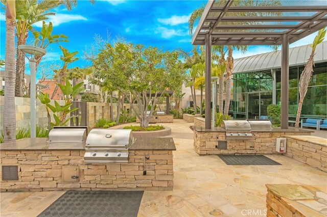 615 Rockefeller, Irvine, CA 92612 - view of patio with exterior kitchen and a pergola