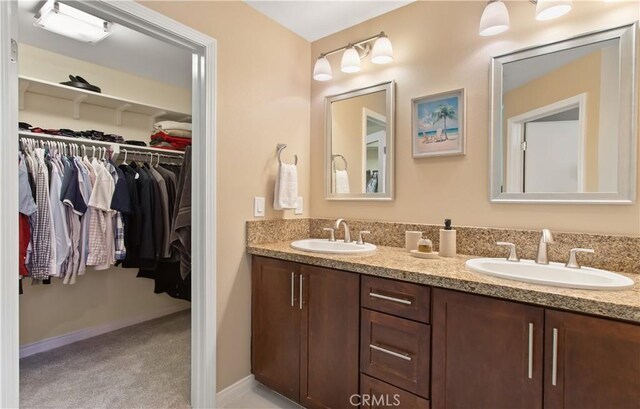 615 Rockefeller, Irvine, CA 92612 - bathroom featuring double vanity and a walk in closet