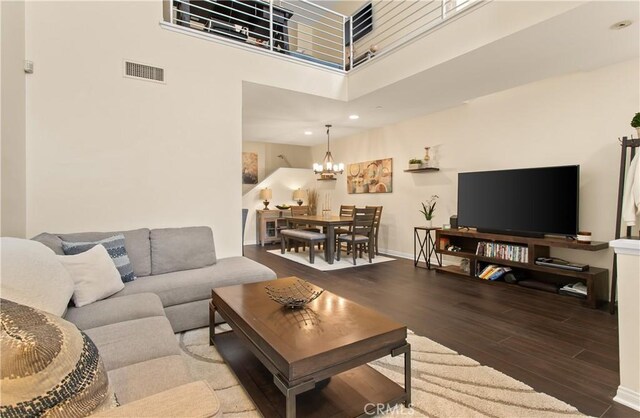 615 Rockefeller, Irvine, CA 92612 - living room featuring wood finished floors, a chandelier, a towering ceiling, and recessed lighting