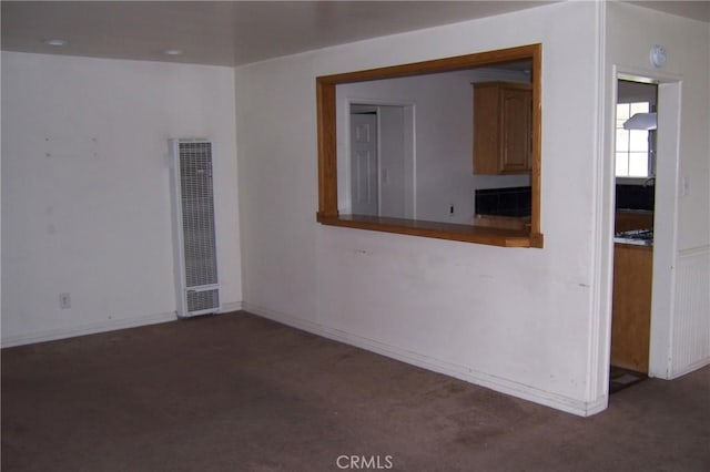 1208 W 23rd St, San Bernardino, CA 92405 - carpeted empty room with a heating unit and a smoke detector