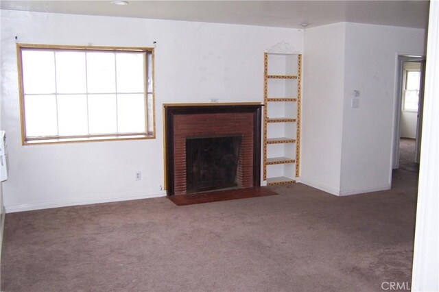 1208 W 23rd St, San Bernardino, CA 92405 - unfurnished living room featuring carpet floors and a fireplace