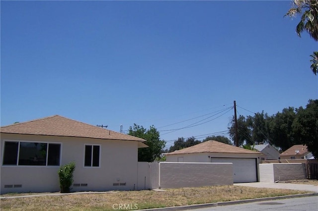 1208 W 23rd St, San Bernardino, CA 92405 - view of home's exterior featuring crawl space and a detached garage