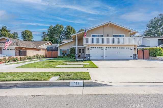 710 W Country Hills Dr W, La Habra, CA 90631 - view of front of home with stucco siding, driveway, stone siding, and a front yard