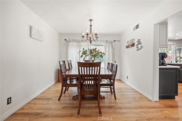 710 W Country Hills Dr W, La Habra, CA 90631 - dining space with light wood-style floors, baseboards, a chandelier, and visible vents