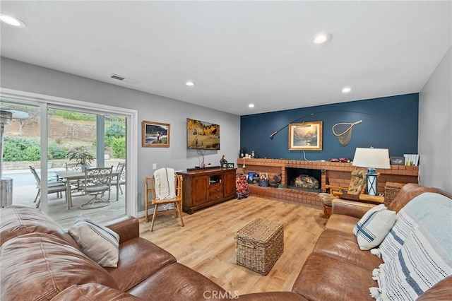 710 W Country Hills Dr W, La Habra, CA 90631 - living room featuring a fireplace, recessed lighting, wood finished floors, and visible vents