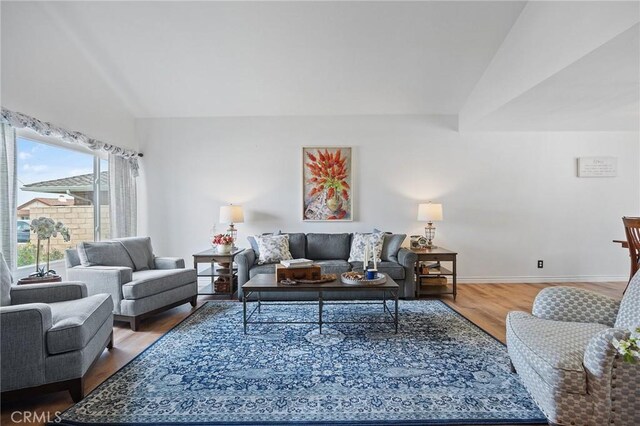 710 W Country Hills Dr W, La Habra, CA 90631 - living room with baseboards, vaulted ceiling, and wood finished floors