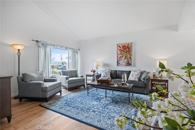 710 W Country Hills Dr W, La Habra, CA 90631 - living room featuring baseboards, vaulted ceiling, and wood finished floors